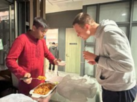 Sattar (Mechanical & Automation Engineering/Year 3) (left), a Bangladesh student host, introduced Chicken Biryani to the participant. 